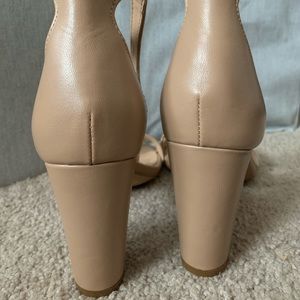 One pair of tan heels